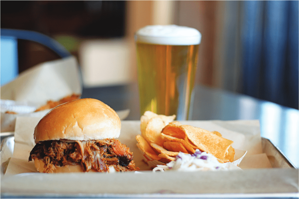 brisket sandwich, housemade chips, and beer